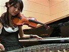 Young Musician Plays Three Instruments at Once